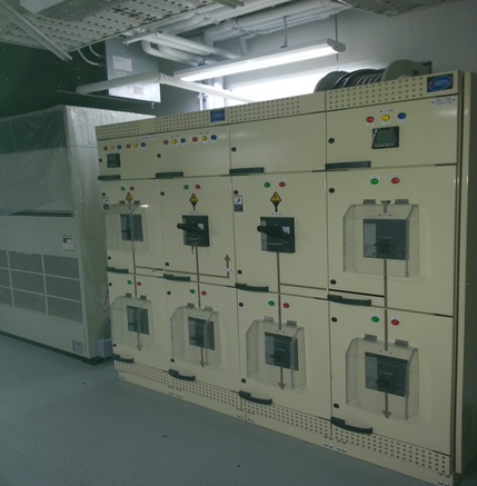 an electrical panel in a room with many different types of switches