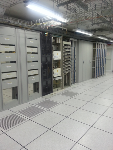 the inside of a large server room with lots of electronic equipment