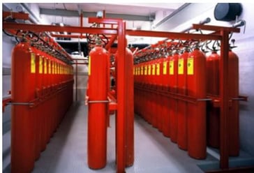 an image of a large room with red fire extinguishers